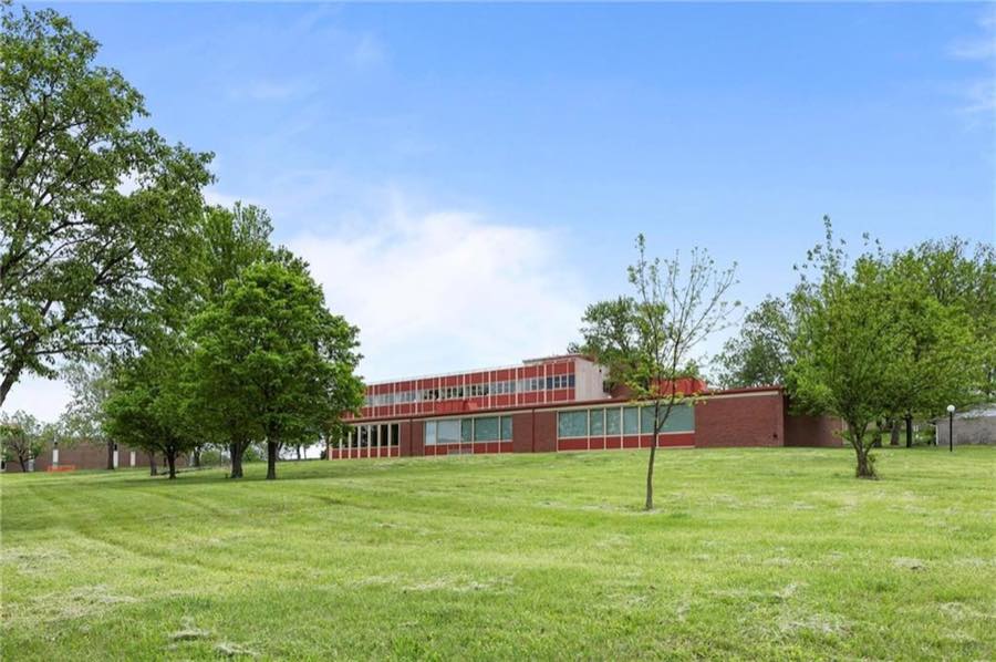 Lawn and brick wings from the east